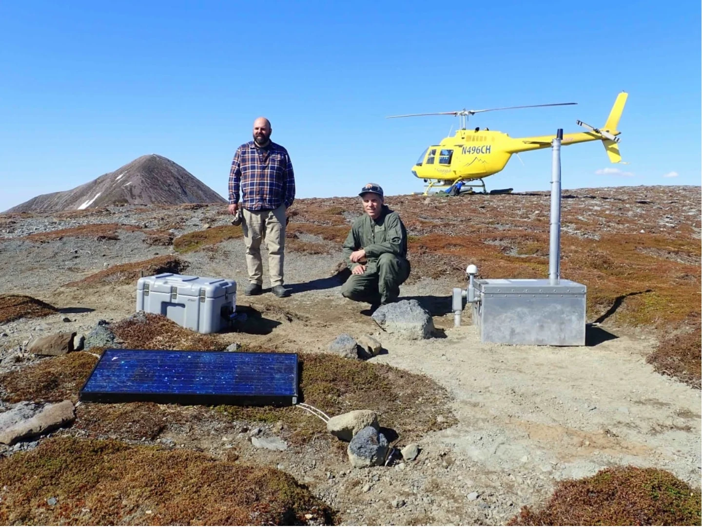 CBC: Max Enders of the U.S. Geological Survey and Max Kaufman of the UAF Geophysical Institute at a temporary seismic station on Crater Ridge, near Mount Edgecumbe. Enders and Kaufman are also with the Alaska Volcano Observatory. ( Max Kaufman/Alaska Volcano Observatory (Submitted by Ronni Grapenthin))