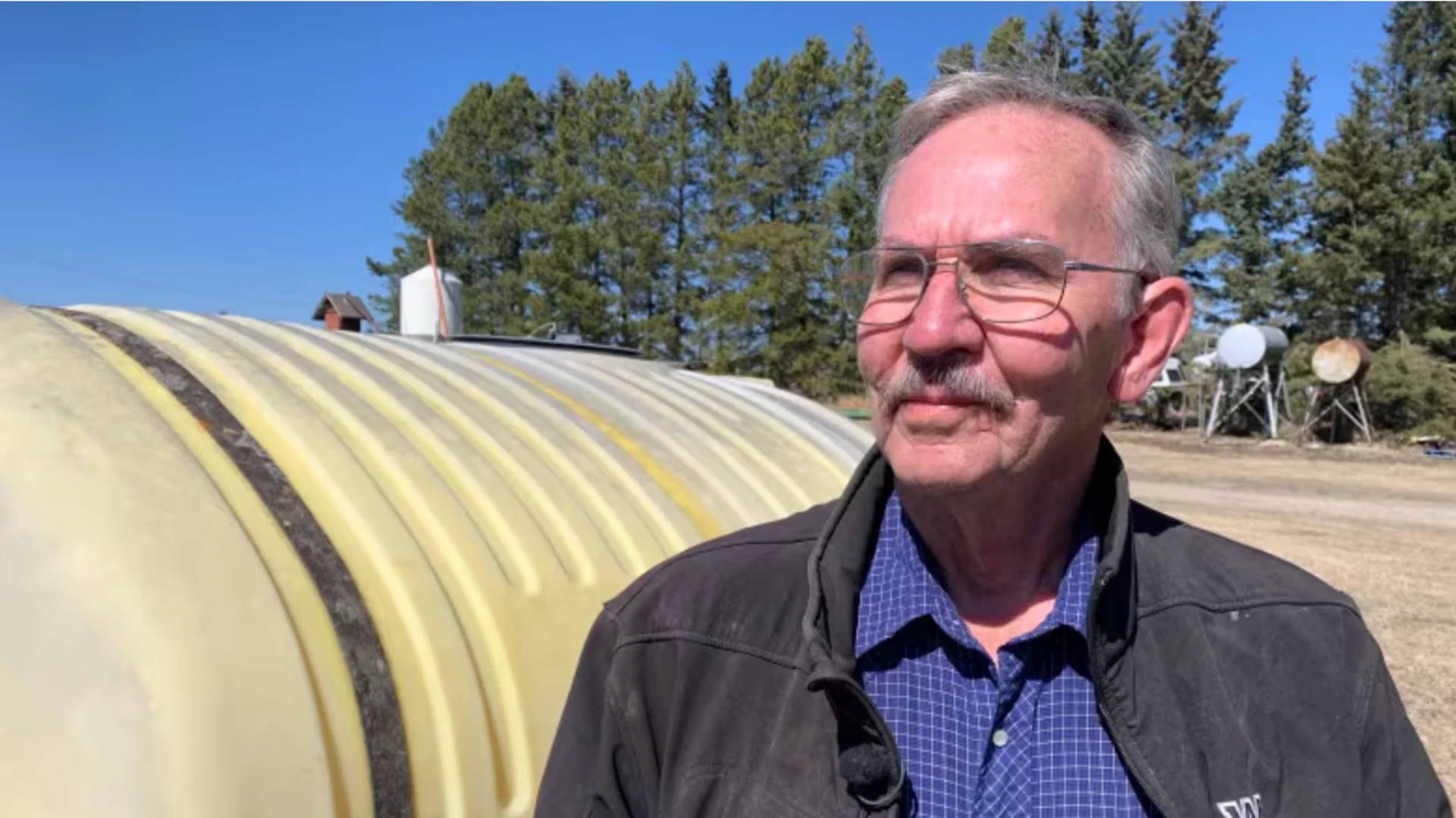 CBC: Jens Jorgensen farms near Wildwood, Alta. Last year, the area was under an evacuation order due to wildfire threats, but Jorgensen decided not to leave, citing concern for his livestock. (Rick Bremness/CBC)