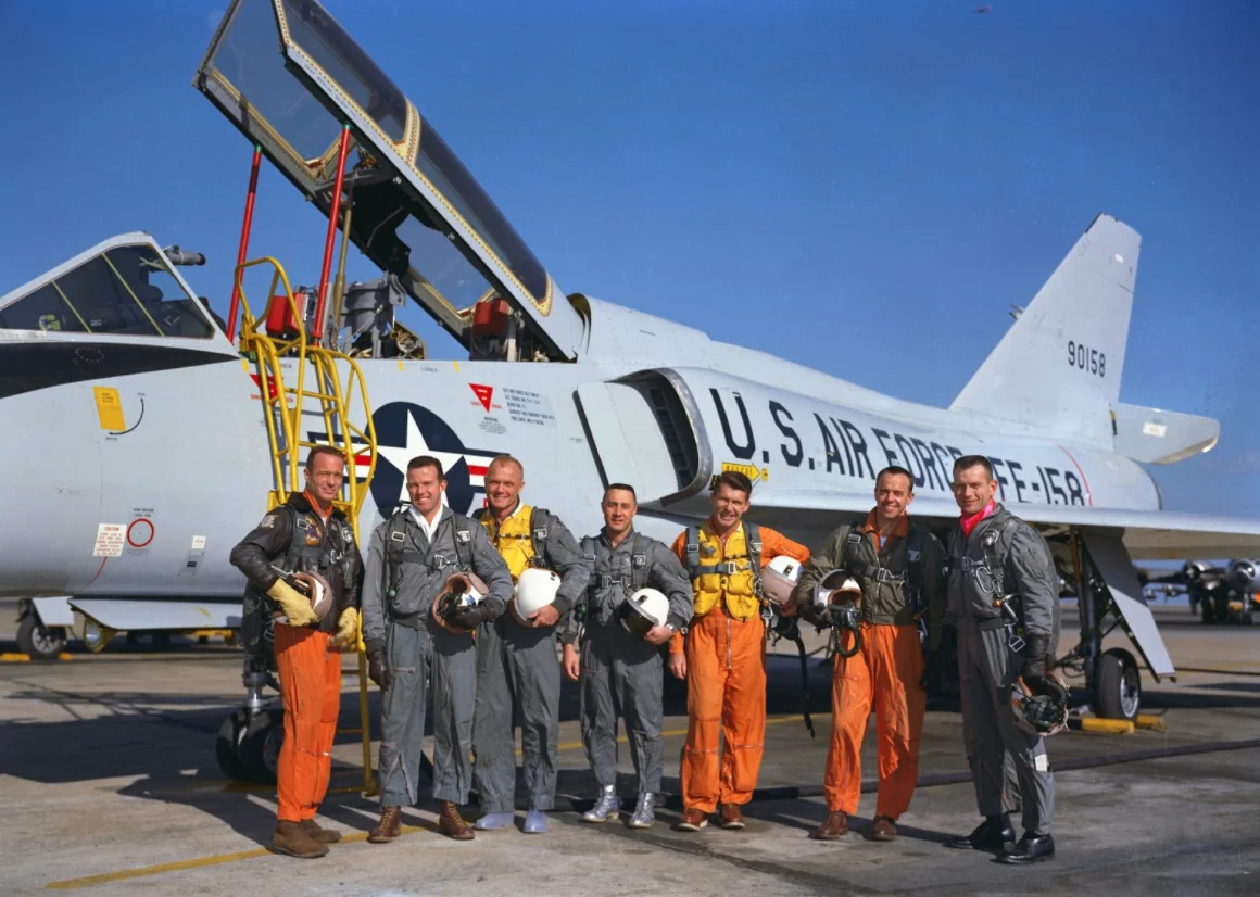 The Mercury Seven in front of an F-106 Delta Dart