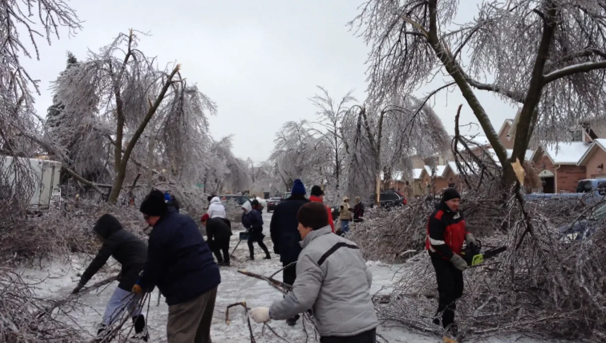 people cleaning up ice storm