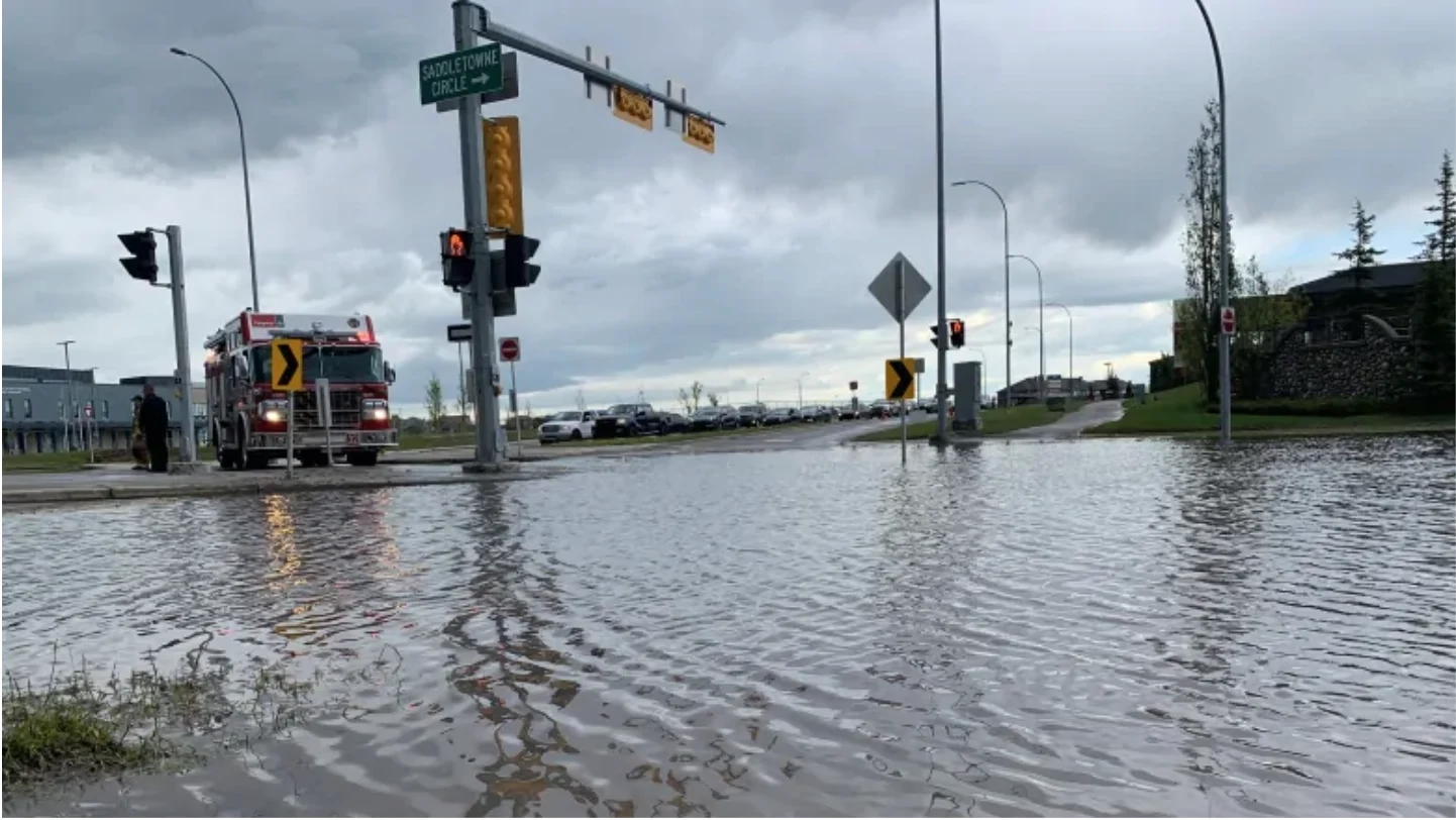 CBC: There was some flooding in northeast Calgary, like this intersection in Saddletowne, after a thunderstorm blew into the city on Sunday. (Terri Trembath/CBC)