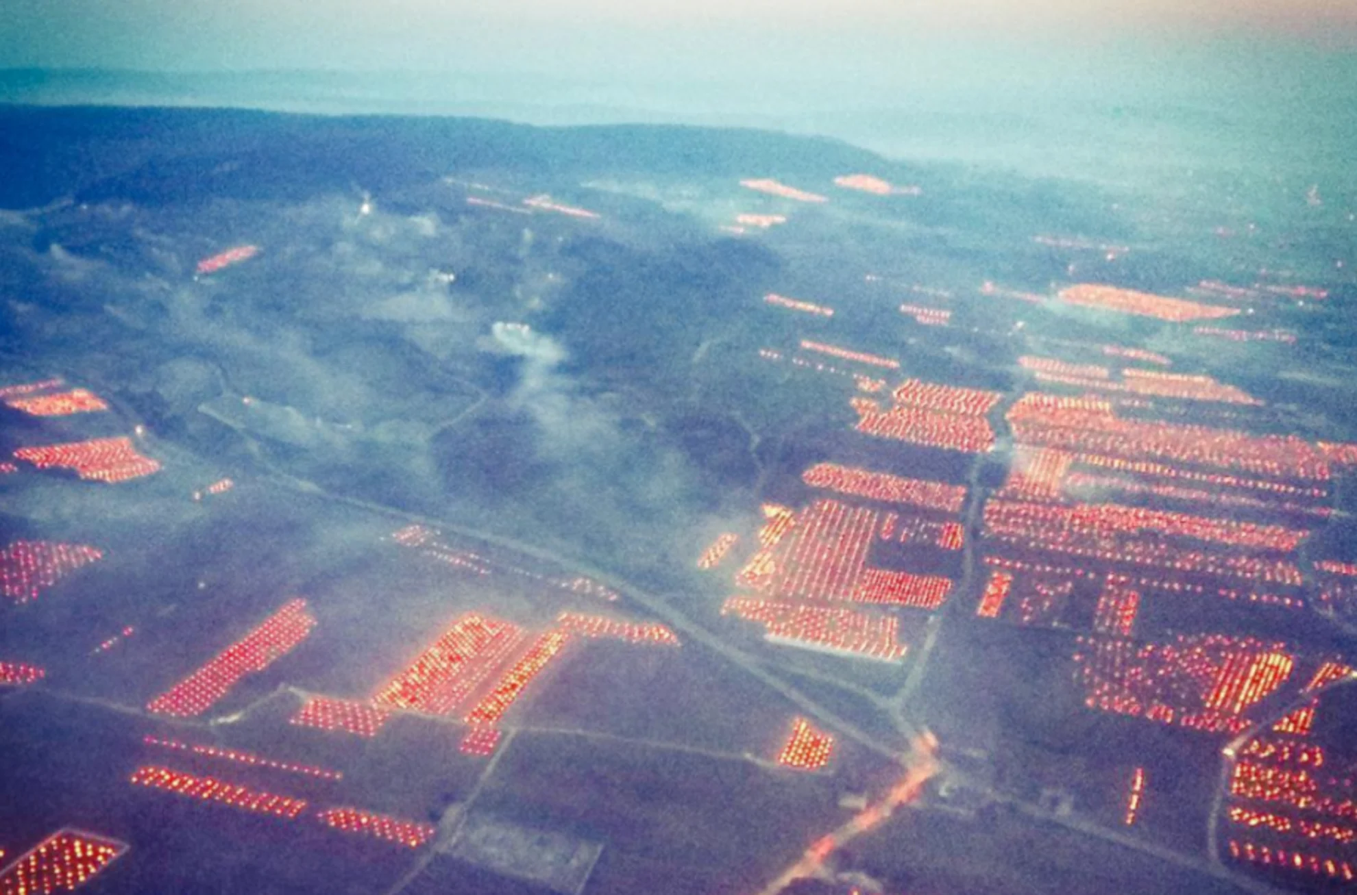 Winemakers in France lit oil drums across their vineyard to avoid frost damage