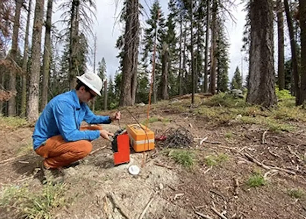 Conversation: A USDA Forest Service employee uses an instrument to measure the moisture conditions deep underground. (Jamie Hinrichs/USDA Forest Service), Author provided
