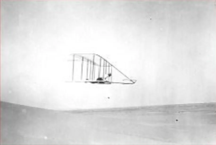 Wilbur Wright flies a glider in earlier tests Kitty Hawk, Oct. 10, 1902.