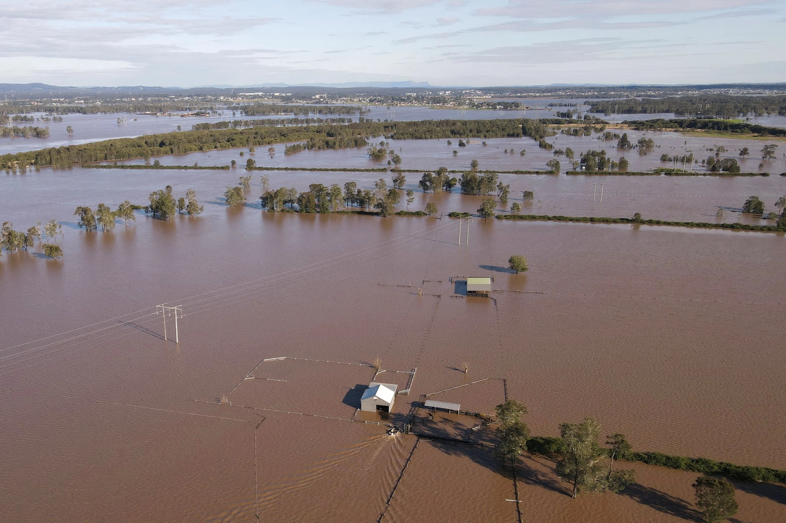 Reuters A drone view shows a flooded area near the Hunter River in Heatherbrae, Australia, May 24, 2025. REUTERS/Hollie Adams