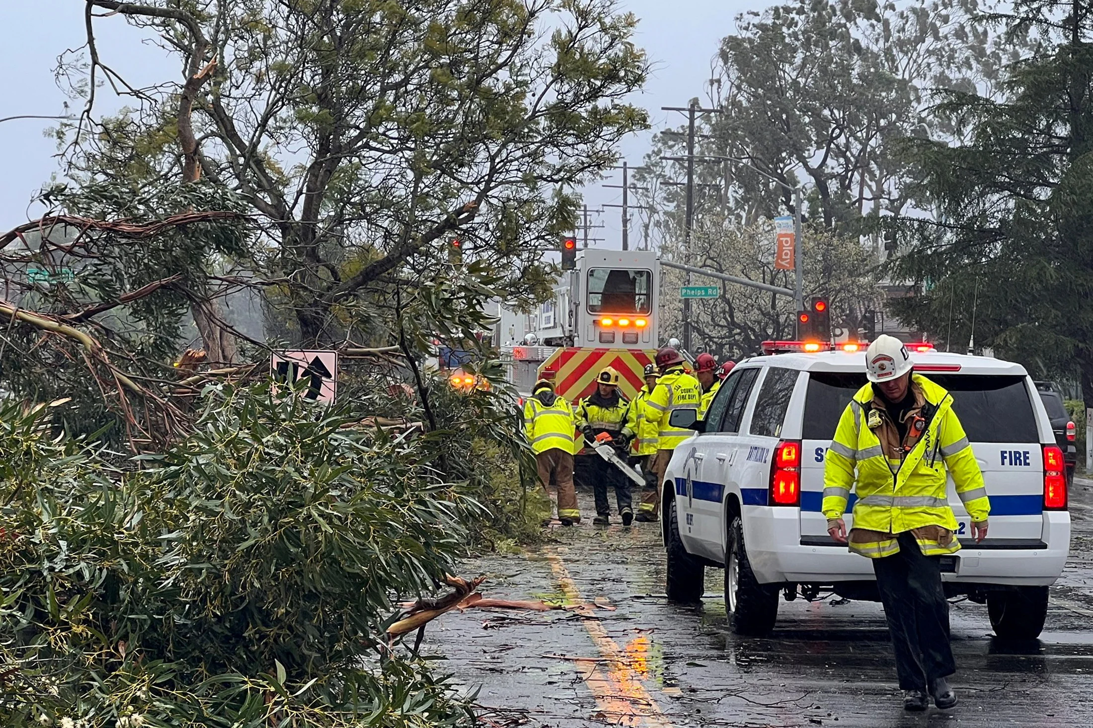 REUTERS: Santa Barbara County firefighters assist city officials to clear a tree blocking Storke Road as the second "Pineapple Express" weather system, or atmospheric river storm, to hit the state in the past week arrived in Goleta, California, U.S. February 4, 2024. Scott Safechuck/Santa Barbara County Fire/Handout via REUTERS