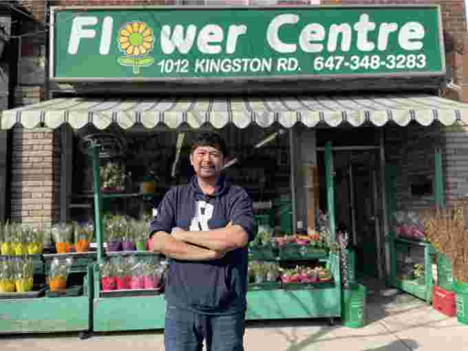 Andy Sue, stands outside his Flower Centre, provided