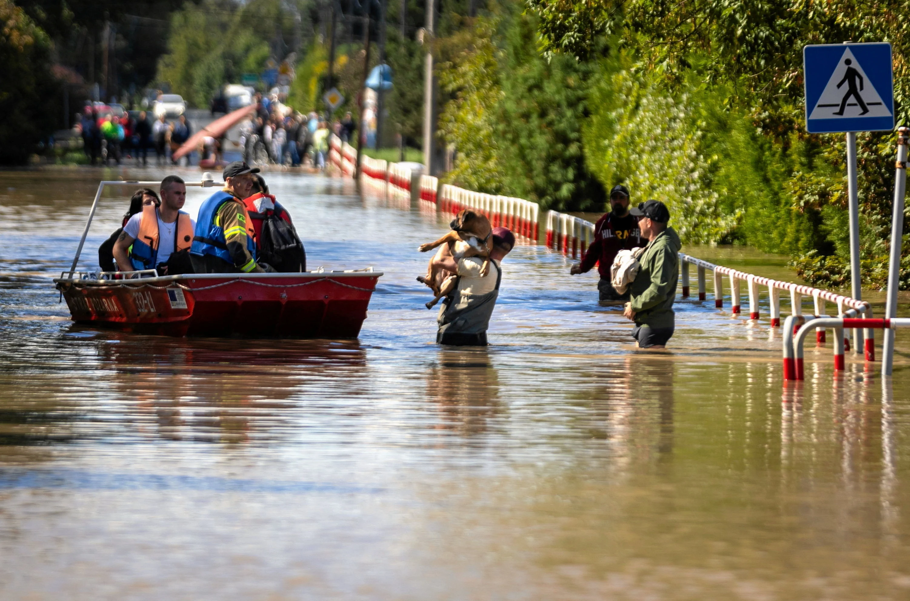 (REUTERS) Boat rescues from flooding in Poland