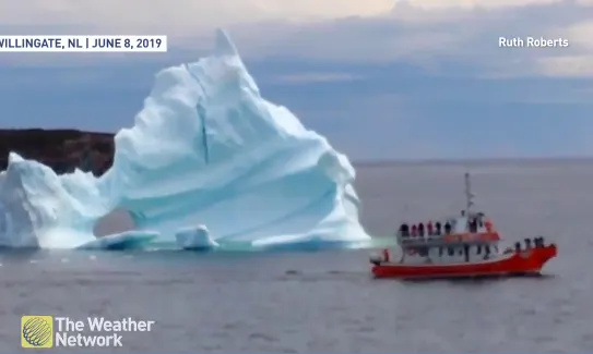 SEE IT: The moment a giant iceberg collapses near a ferry