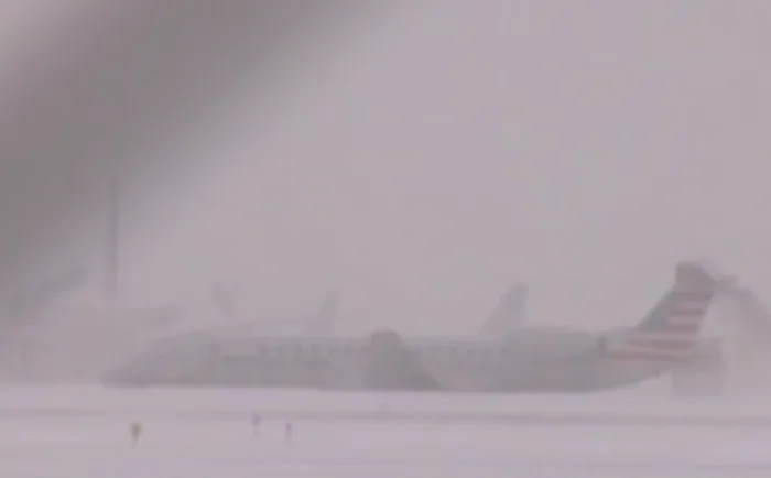 Airplane skids off runway at Chicago's O'Hare Airport amid snow