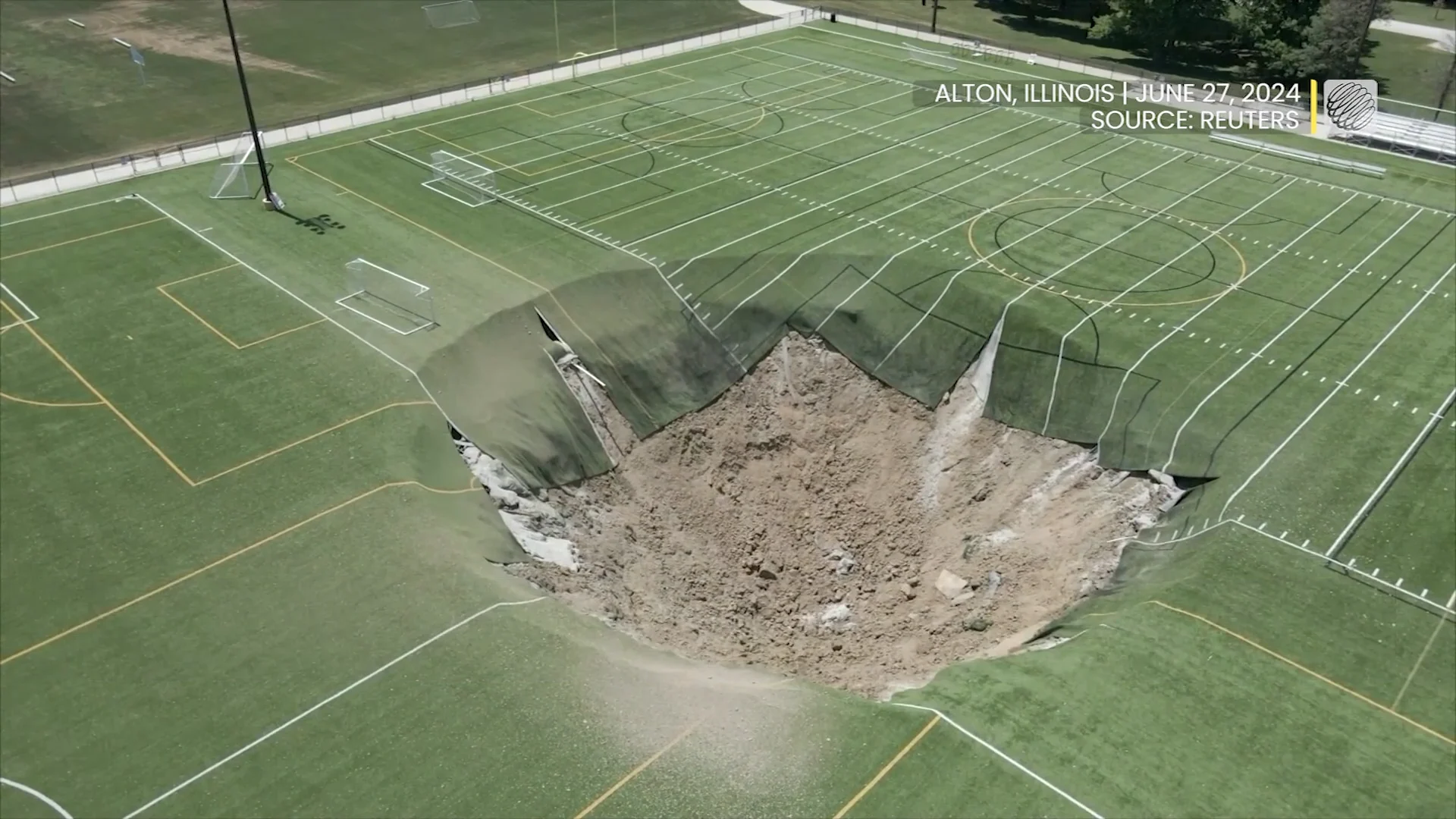 Watch as a huge sinkhole swallows the middle of a soccer field