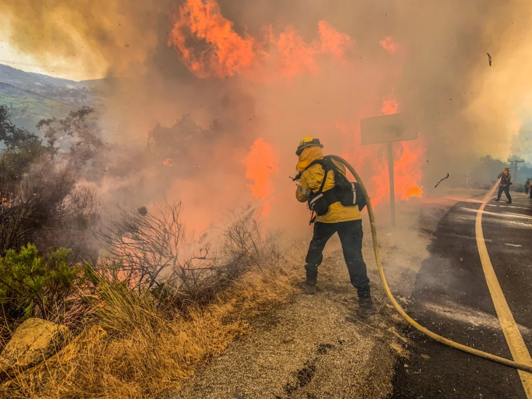 Reuters - Firefighters work to extinguish a fire in Alpine, California, U.S., September 6, 2020, in this picture obtained from social media. Picture taken September 6, 2020. Steve Russo/via REUTERS