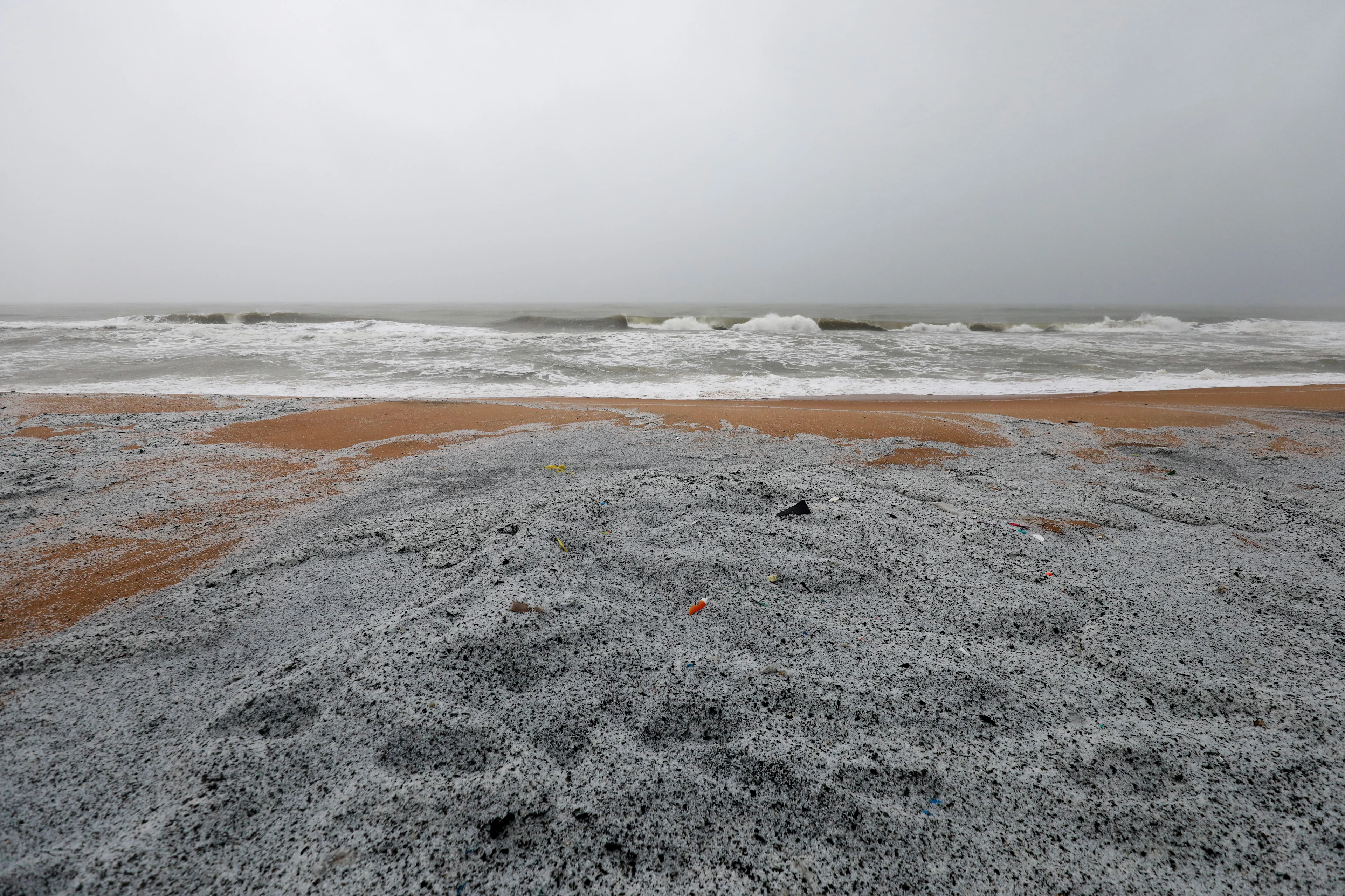 Plastic pellets washed off to a beach from the MV X-Press Pearl cargo ship, which caught fire and sank off the Colombo Harbour, are seen in Ja-Ela, Sri Lanka June 3, 2021. REUTERS/Dinuka Liyanawatte