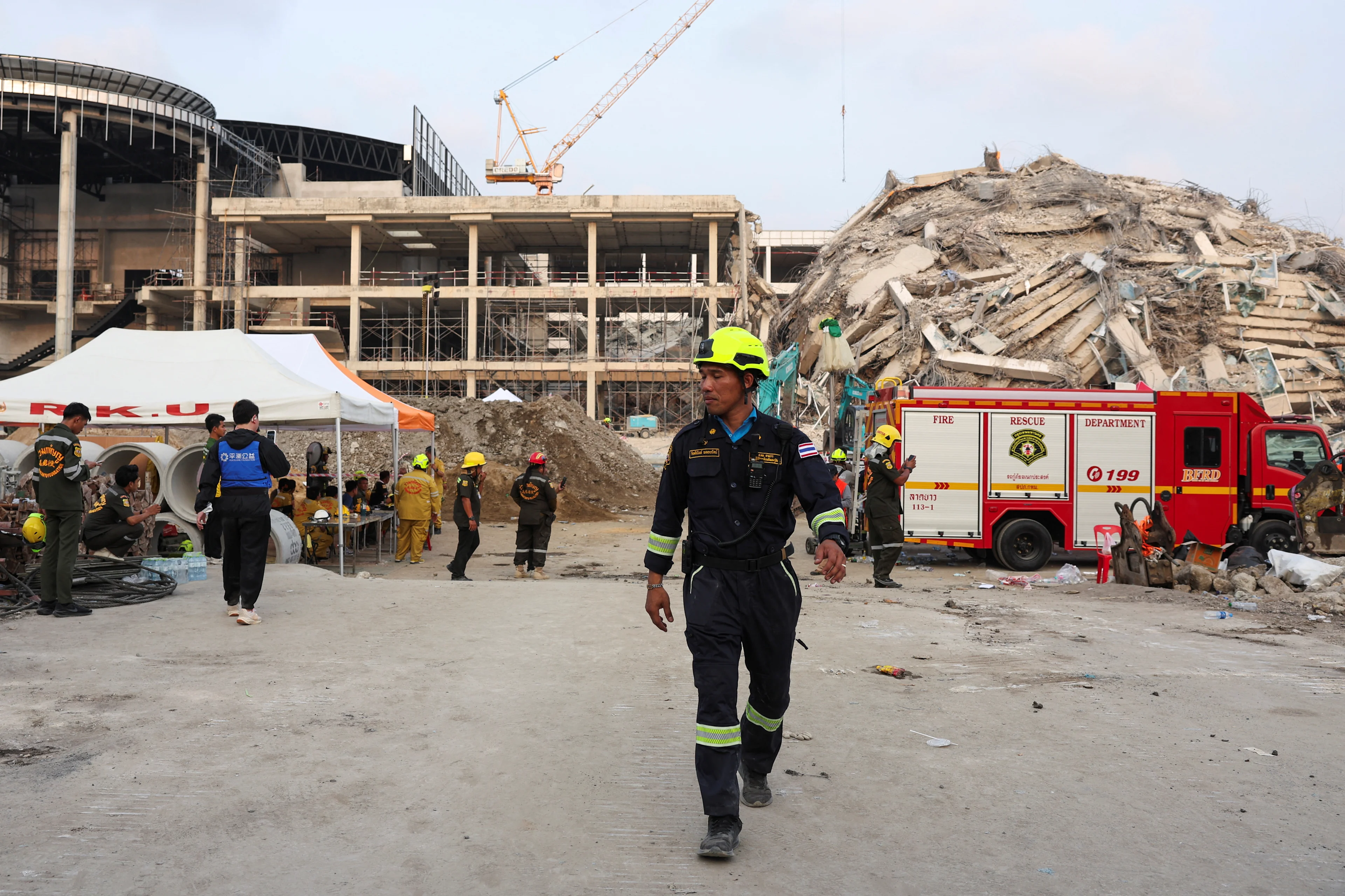 REUTERS: Rescue personnel attend the site of a building that collapsed, following a strong earthquake, in Bangkok, Thailand, March 29, 2025. REUTERS/Chalinee Thirasupa