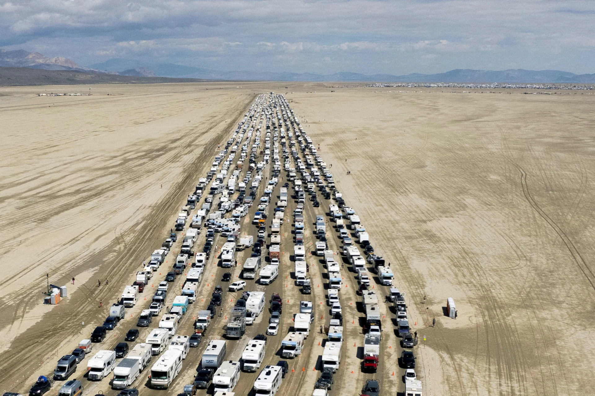 Burning Man festival road reopens, allowing thousands to escape muddy trap