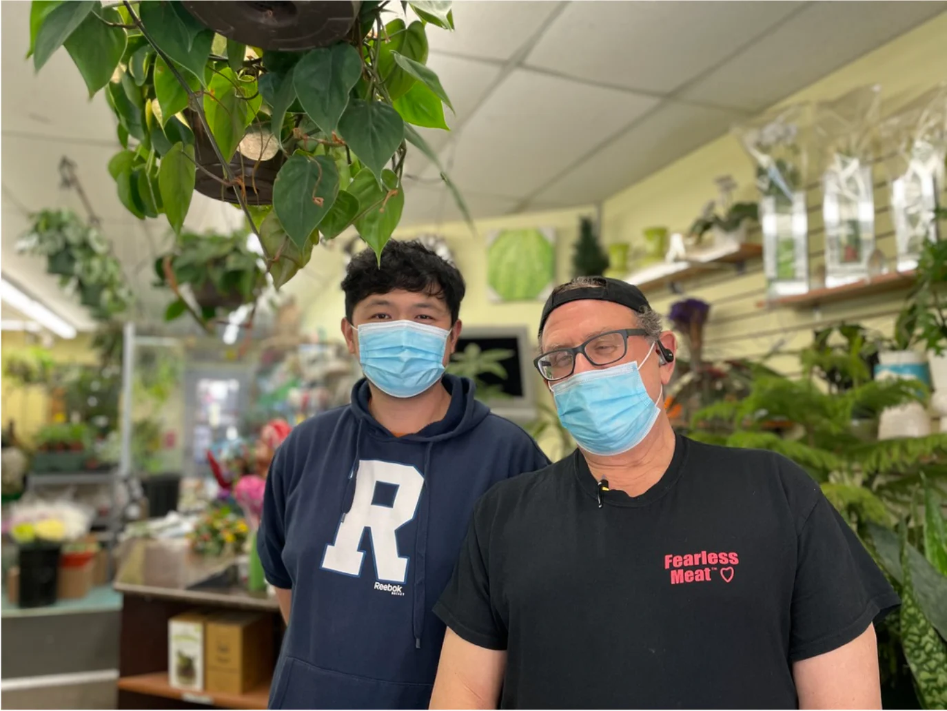 Provided: L-R, Flower Centre owner Andy Sue thanks restaurant owner, David Brown for fighting discrimination with flowers, provided