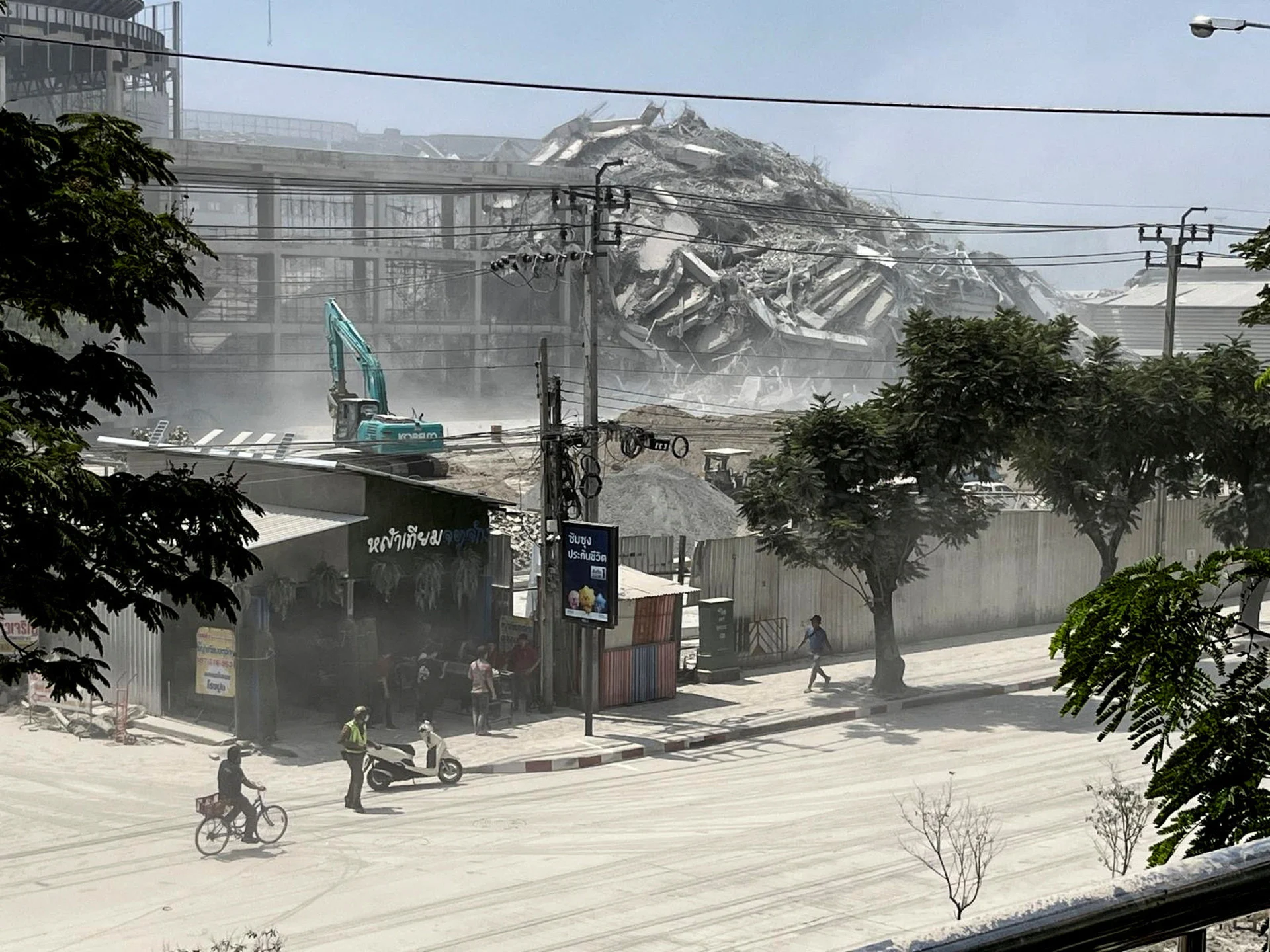 Reuters: View of a collapsed building after a strong earthquake struck central Myanmar on Friday, earthquake monitoring services said, which affected Bangkok as well with people pouring out of buildings following the tremors in the Thai capital, in Bangkok, Thailand, March 28, 2025. REUTERS/Ann Wang