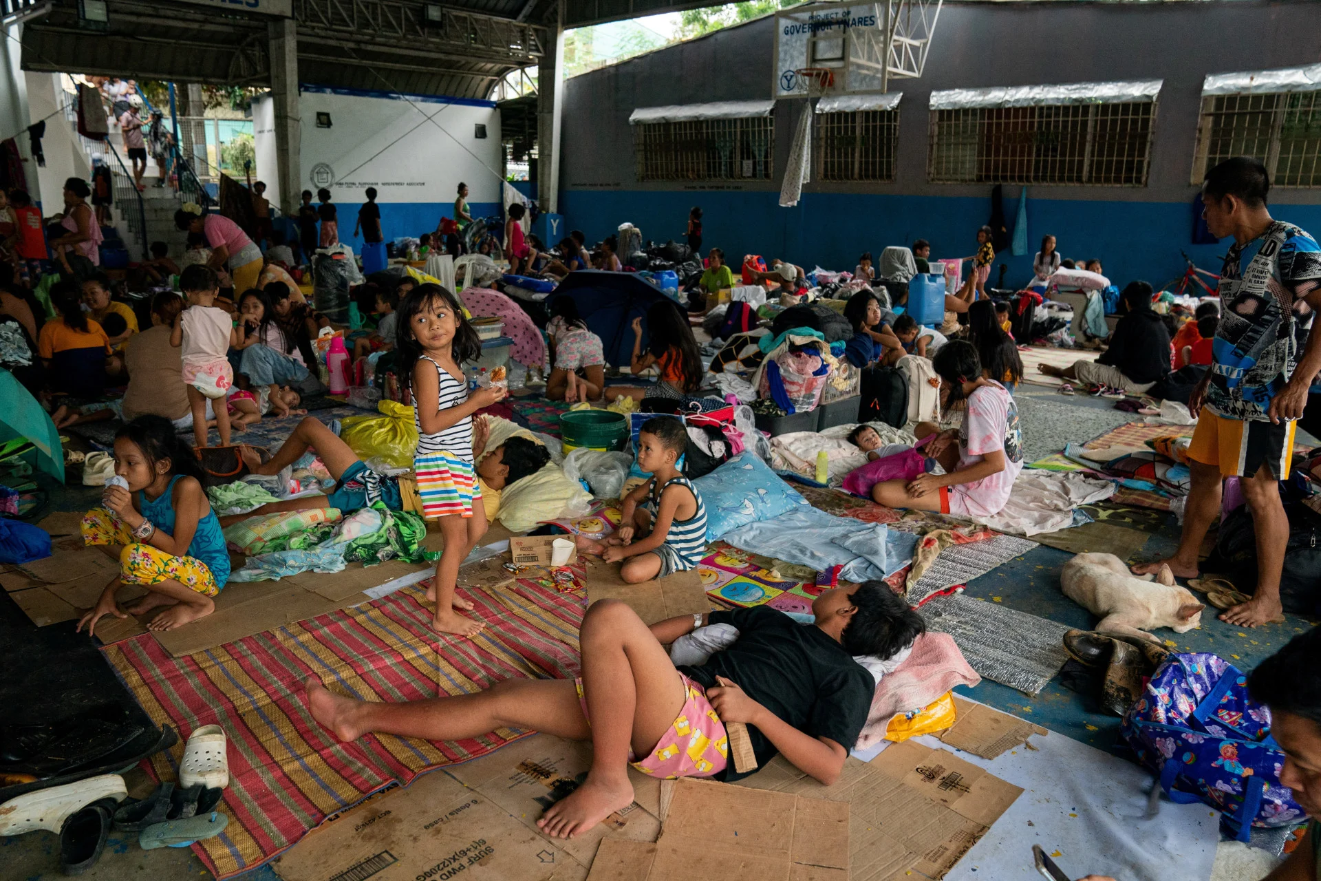 Reuters: People take shelter at a basketball court temporarily converted into an evacuation center following the floods brought by Typhoon Gaemi, in San Mateo town, Rizal province, Philippines, July 25, 2024. REUTERS/Lisa Marie David