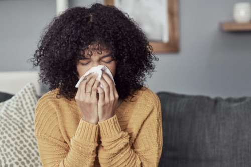 Woman Holding Tissue or Handkerchief and Wiping Blood Off Her Nose