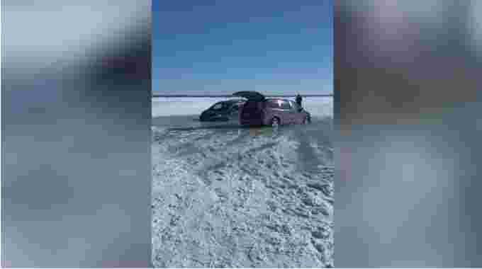 Submitted - Photo courtesy: J’s Fish Hut Rentals. Rob Crosbie and his crew had to pull cars out of a frozen lake after they fell through. 