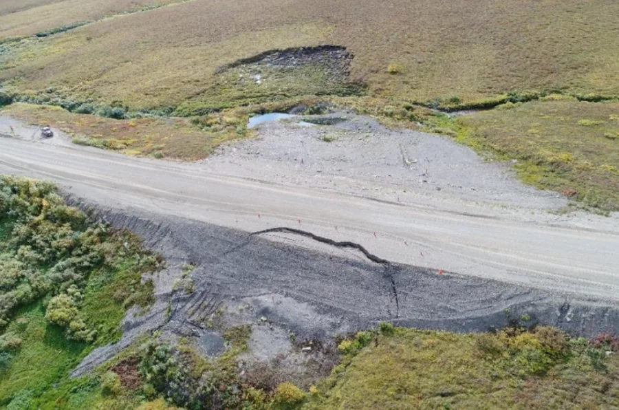 A section of the Dempster Highway where permafrost thaw is causing the road's embankment to collapse. (Northwest Territories Geological Survey)