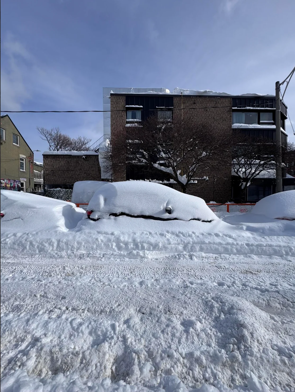 Provided/Chris Rowe: Toronto, Ontario snowbanks, heavy snowfall, historic snow. Car buried in snow. Day after historic storm. (Shot taken: Jan. 26, 2026)