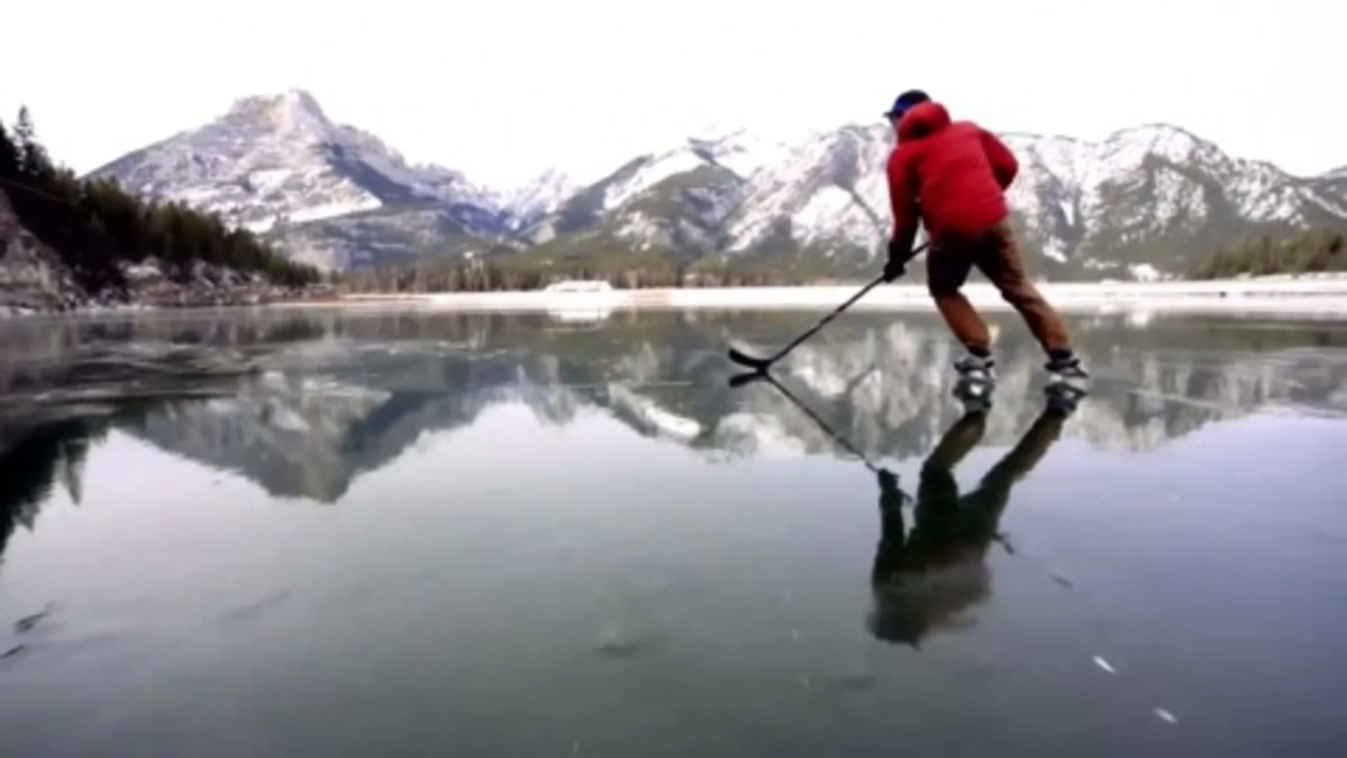 VIDEO: Skaters glide on crystal-clear frozen mountain lakes