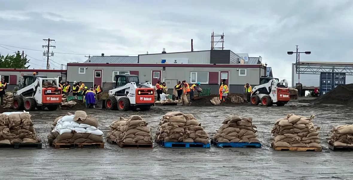 CBC: Sandbags are piled up on pallets, ready to be distributed in Teslin, Yukon, last June. (Mike Rudyk/CBC)