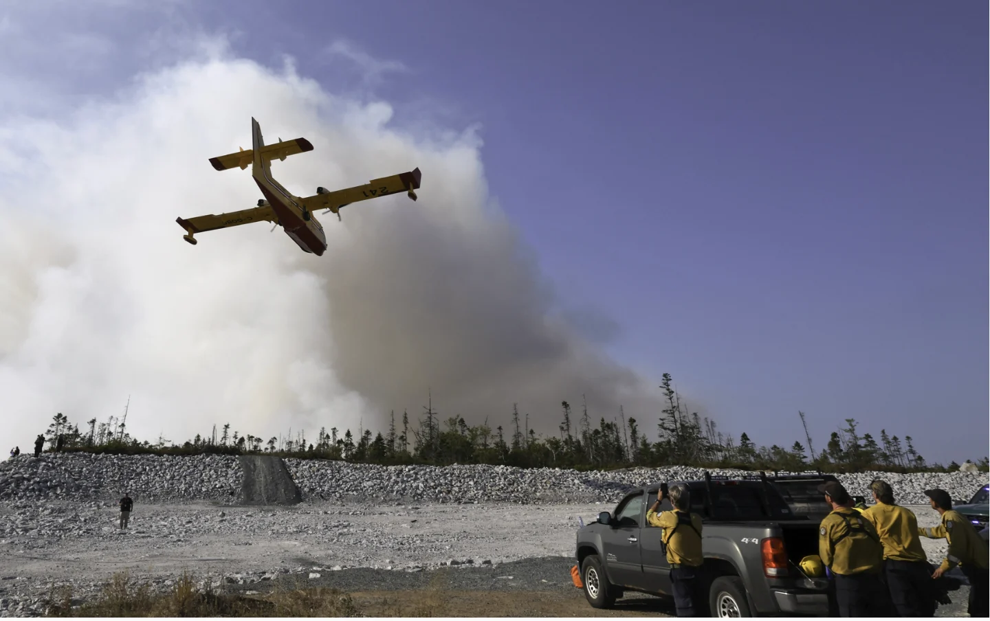 Province of Nova Scotia (use with credit): A water bomber make a pass over the Susies Lake wildfire in Halifax Regional Municipality. (Province of Nova Scotia)