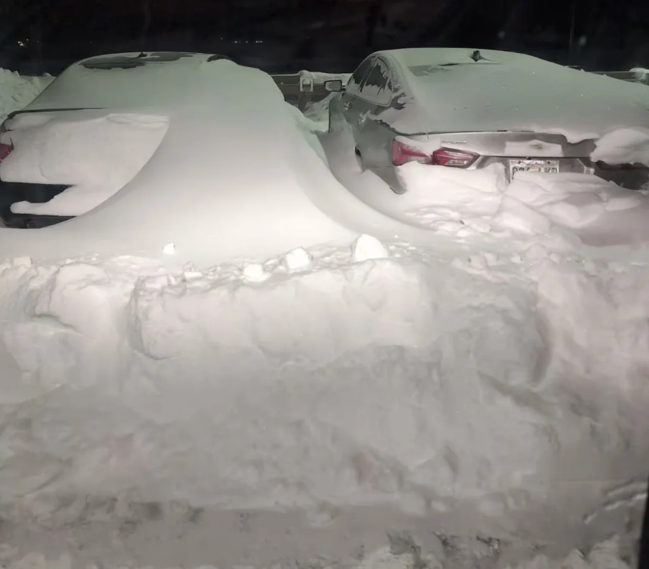Snow covers vehicles in a parking lot in Saskatoon. Submitted by Benjamin Semynov via CBC