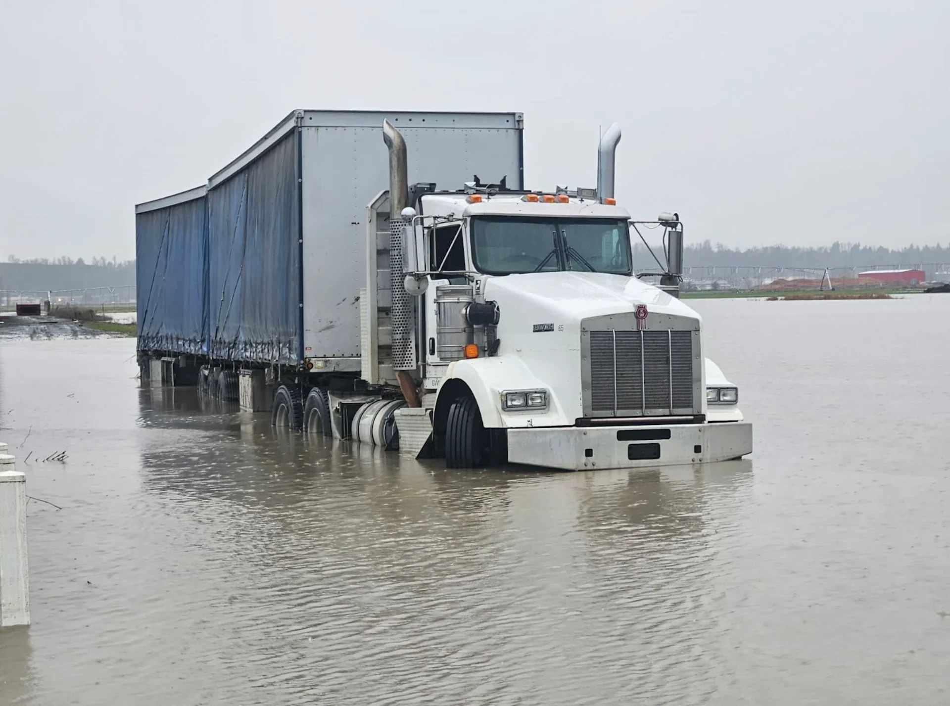 Connor O'Donovan: 2025 B.C. Flood - Dec. 16, 2025: Sumas Prairie, British Columbia, floods, truck, road covered in floodwaters