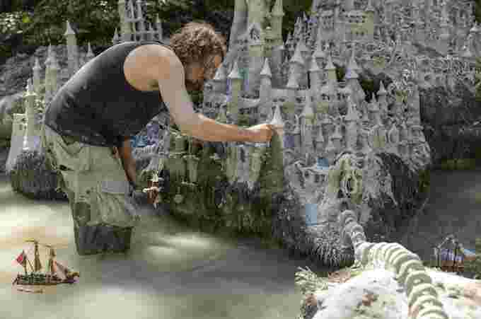 Land Art artist Francois Monthoux is working on his "Monthoux Castle" Made from clay extracted from the dried bed of the Le Toleure river in Saubraz, Switzerland, due to the ongoing drought on August 12, 2022.  REUTERS/Denis Balibouse