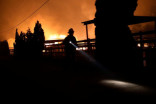 Fast-moving Los Angeles wildfire destroys homes, prompts evacuation orders