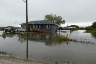 Manitobans wade through flooded streets, basements after massive downpour