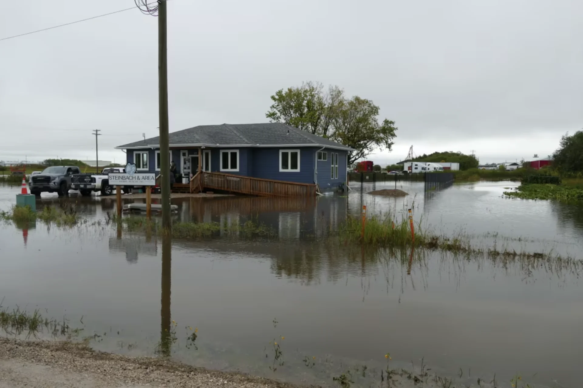 Manitobans wade through flooded streets, basements after massive downpour