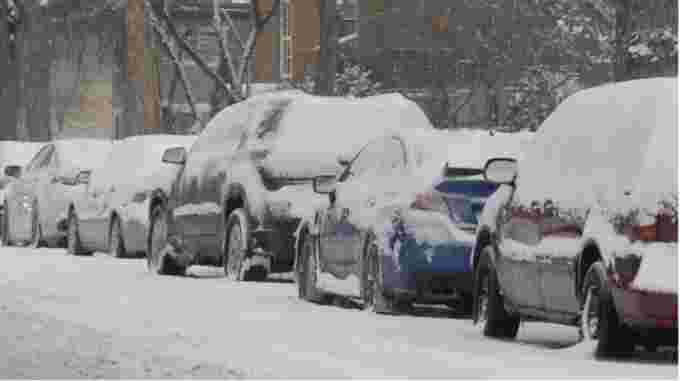 CBC: Cars parked on an Edmonton street after heavy snow this month. Edmonton's first citywide residential parking ban goes into effect at 12:01 a.m. Tuesday. (Jamie McCannel/CBC)