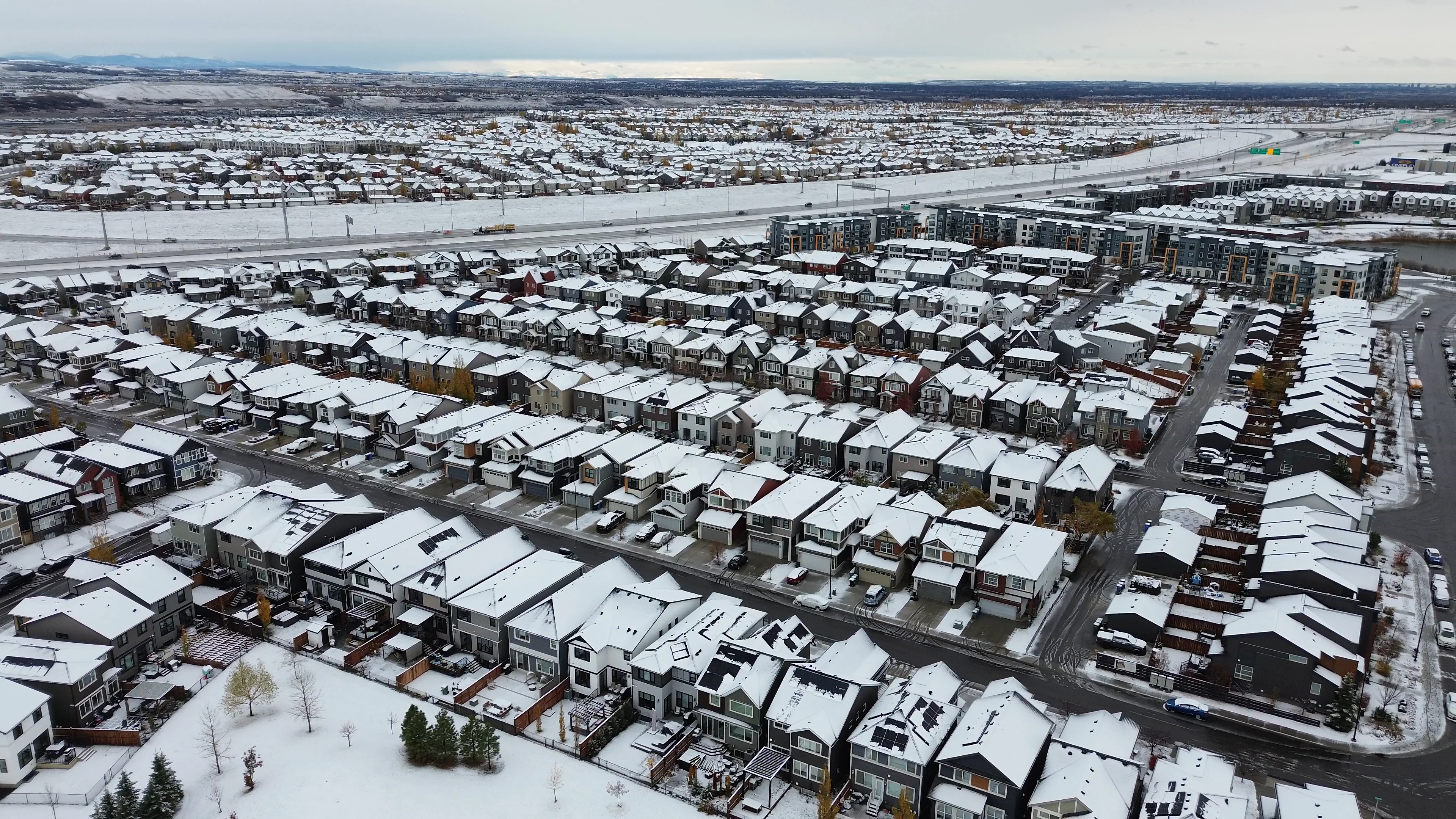 Aerial view of a snowy Calgary neighbourhood on Oct. 23, 2026 (Connor O'Donovan/TWN)