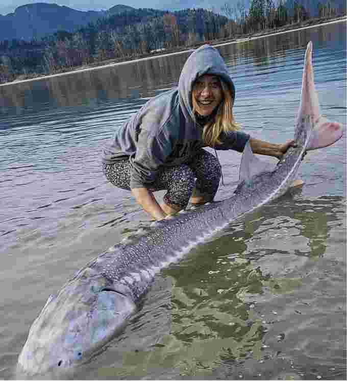 CBC: Sidney Kozelenko and the large sturgeon caught and released in Fraser River, B.C. (Supplied by Sidney Kozelenko )