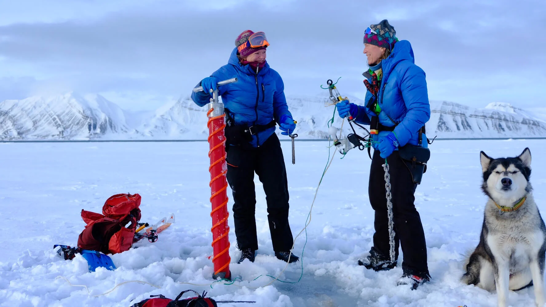 Sorby and Fålun Strøm collect samples while Ettra supervises their work. (Hearts in the Ice)