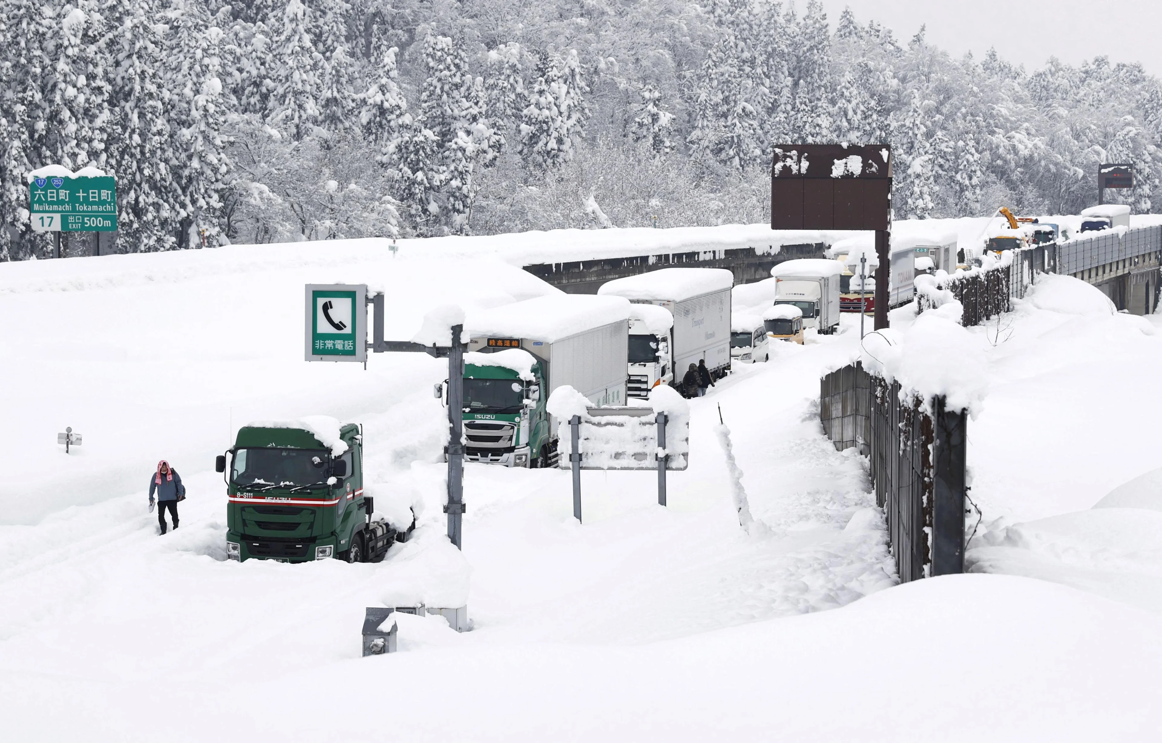 Vehicles are stranded on the snow-covered Kanetsu expressway in Minamiuonuma in Niigata Prefecture, Japan in this photo taken by Kyodo December 18, 2020 Mandatory credit Kyodo/via REUTERS ATTENTION EDITORS - THIS IMAGE WAS PROVIDED BY A THIRD PARTY. MANDATORY CREDIT. JAPAN OUT. NO COMMERCIAL OR EDITORIAL SALES IN JAPAN