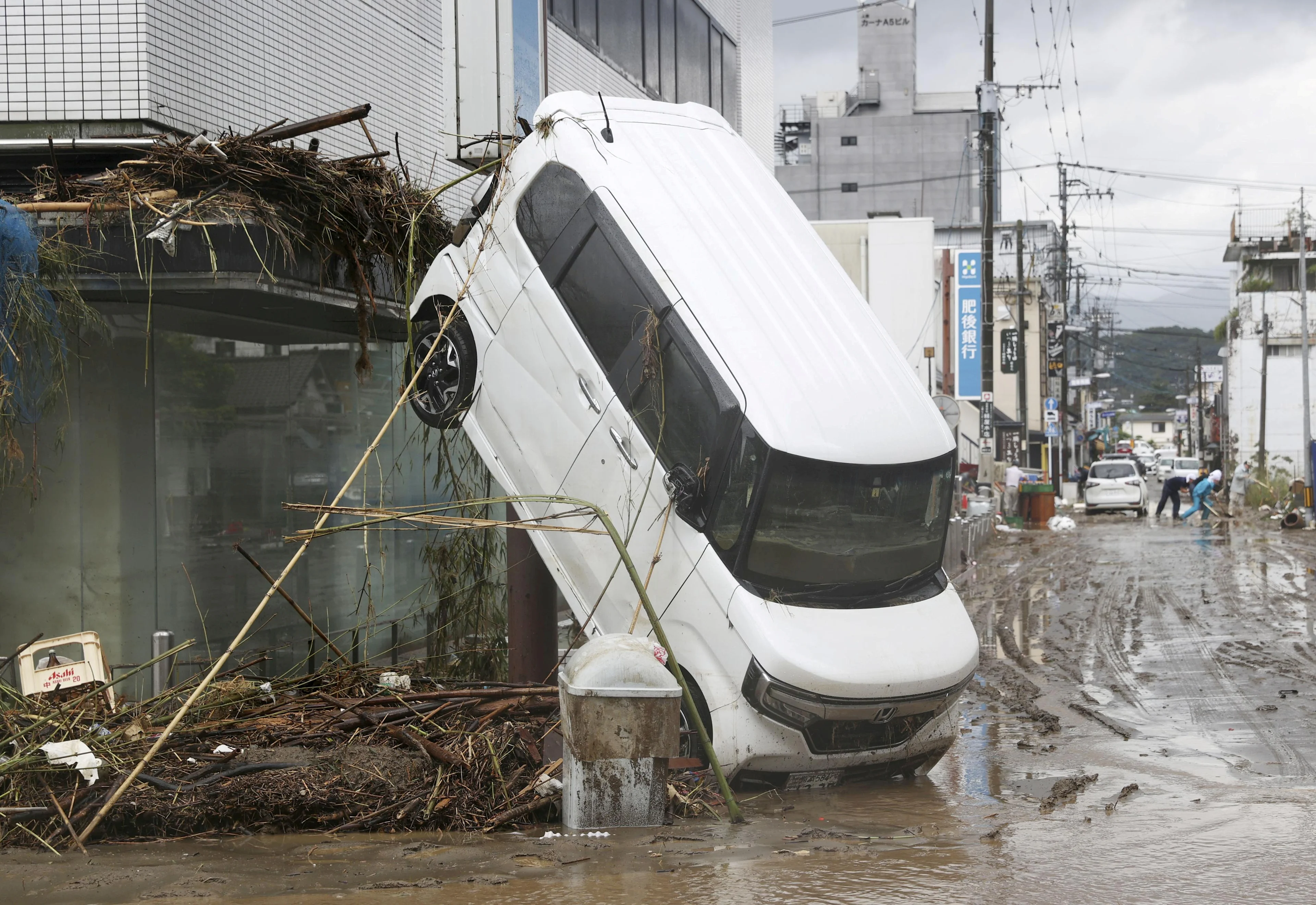 REUTERS:  A car is pictured after it was drifted by torrential rain in Hitoyoshi, Kumamoto prefecture, southern Japan, in this photo taken by Kyodo July 6, 2020. Mandatory credit Kyodo/via REUTERS ATTENTION EDITORS - THIS IMAGE WAS PROVIDED BY A THIRD PARTY. MANDATORY CREDIT. JAPAN OUT. NO COMMERCIAL OR EDITORIAL SALES IN JAPAN. TPX IMAGES OF THE DAY