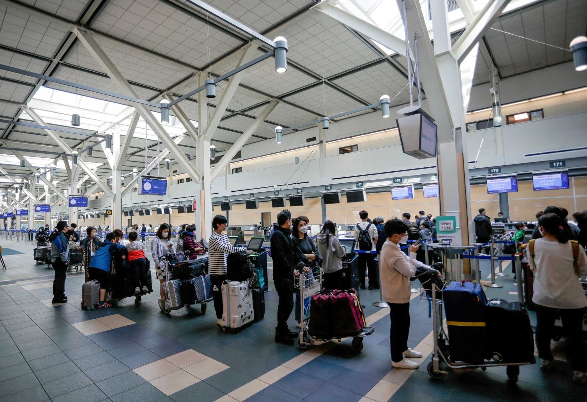 Travellers line up at Vancouver International Airport in Richmond, British Columbia, Canada, on June 14, 2022. (Xinhua News Agency/ Getty Images)