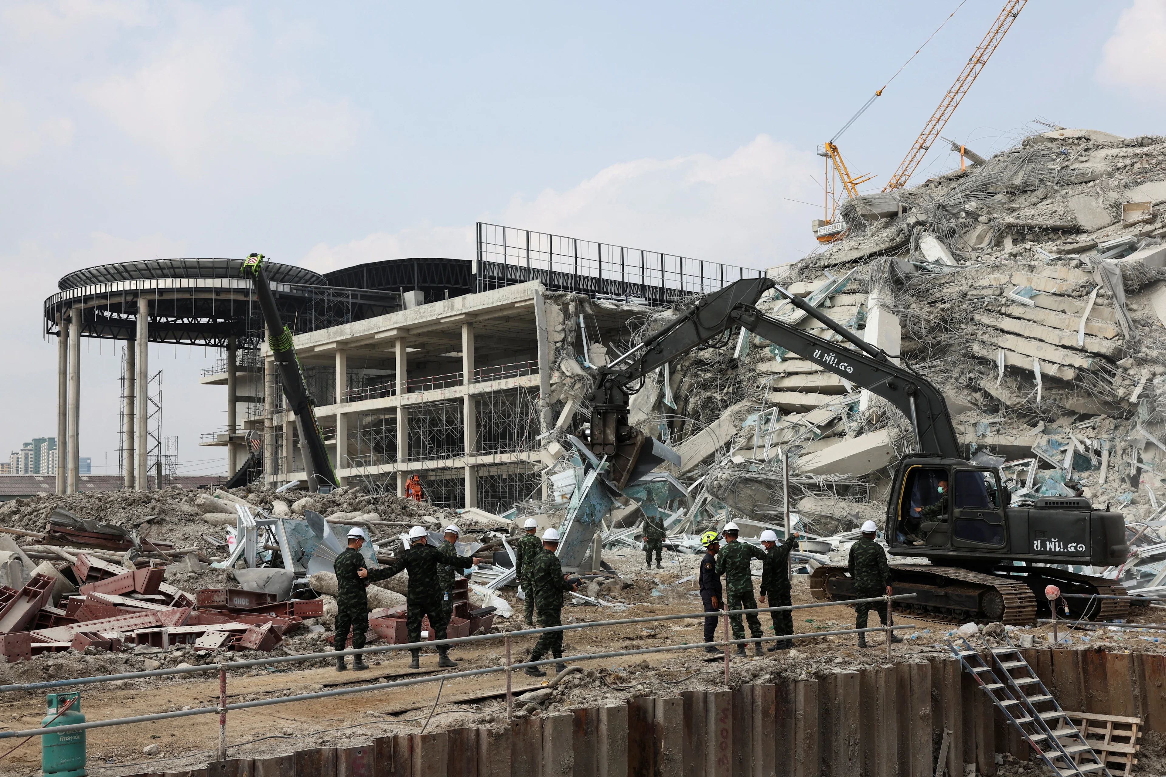 REUTERS: Rescue personnel work at the site of a building that collapsed, following a strong earthquake, in Bangkok, Thailand, March 29, 2025. REUTERS/Chalinee Thirasupa