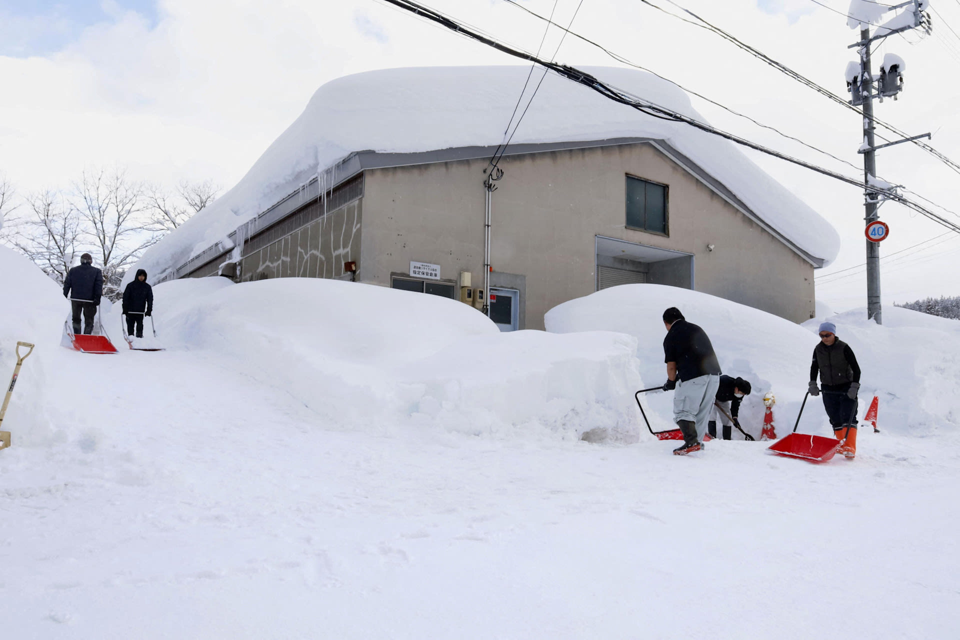 7-ft pileup of snow: Soldiers, snow plows battle deadly winter storms in Japan