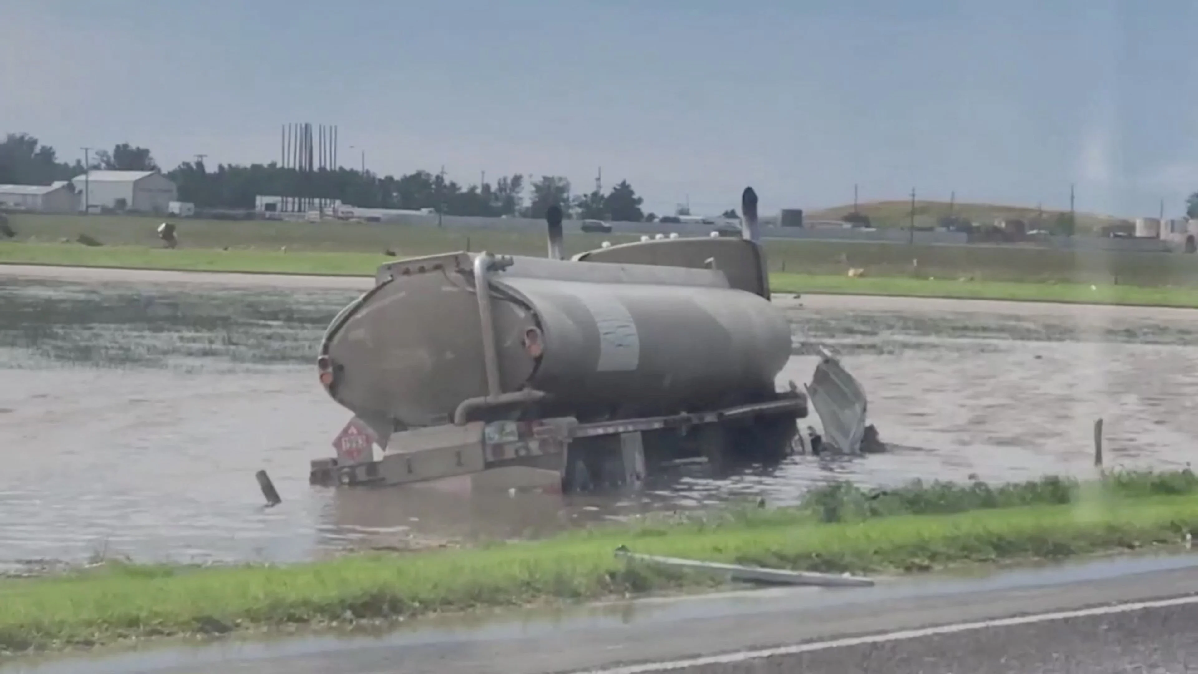 Reuters: A tank truck gets partially submerge in water in Perryton as the town gets struck by a tornado, in Texas, U.S. June 15, 2023, in this screengrab obtained from a social media video. Sabrina Devers via TMX/via REUTERS