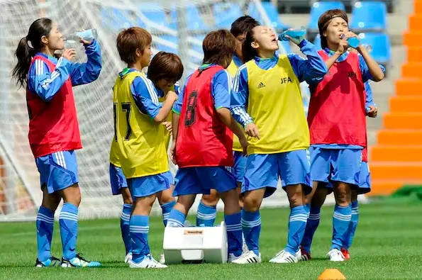 Japan’s women’s soccer team players hydrate during training on the eve of the match between Japan and New Zealand at the Women’s World Cup in Bochum, Germany, on June 26, 2011. (AP Photo/Martin Meissner)