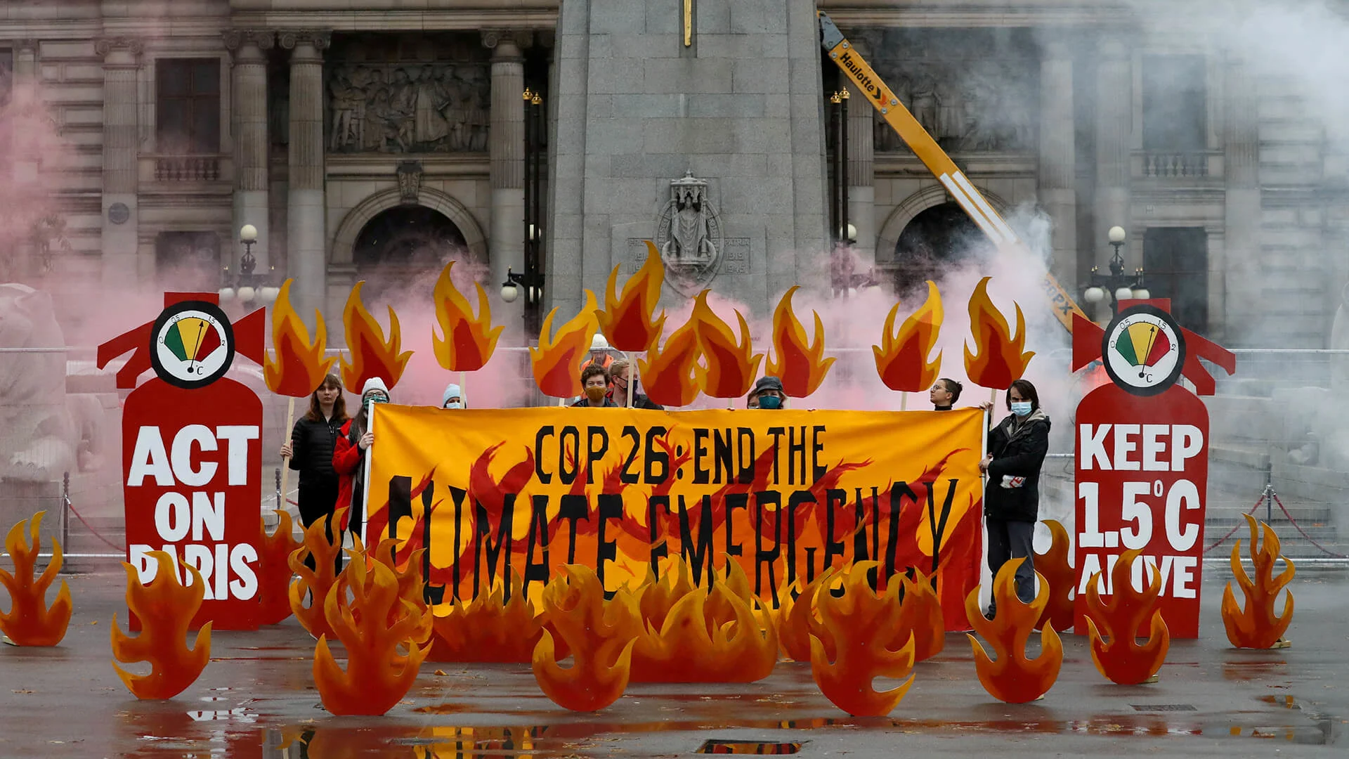 Activists symbolically set George Square on fire with an art installation of faux flames and smoke ahead of the UN Climate Change Conference (COP26), in Glasgow, Scotland, Britain October 28, 2021. REUTERS/Russell Cheyne/File Photo