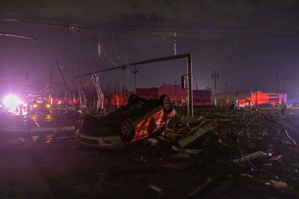 (REUTERS) Car flipped by tornado in New Orleans