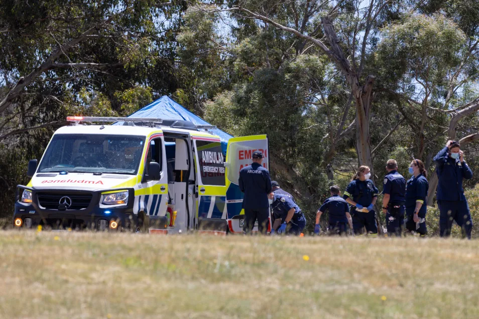 REUTERS: Emergency services personnel inspect the scene at Hillcrest Primary School. Five children have died and four are being treated in hospital, with some critically injured, after a bouncy castle accident in the Australian state of Tasmania, police said on Thursday.