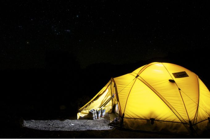 PEXELS: Camping under starry sky. Courtesy: Pixabay. URL: https://www.pexels.com/photo/yellow-tent-under-starry-night-45241/
